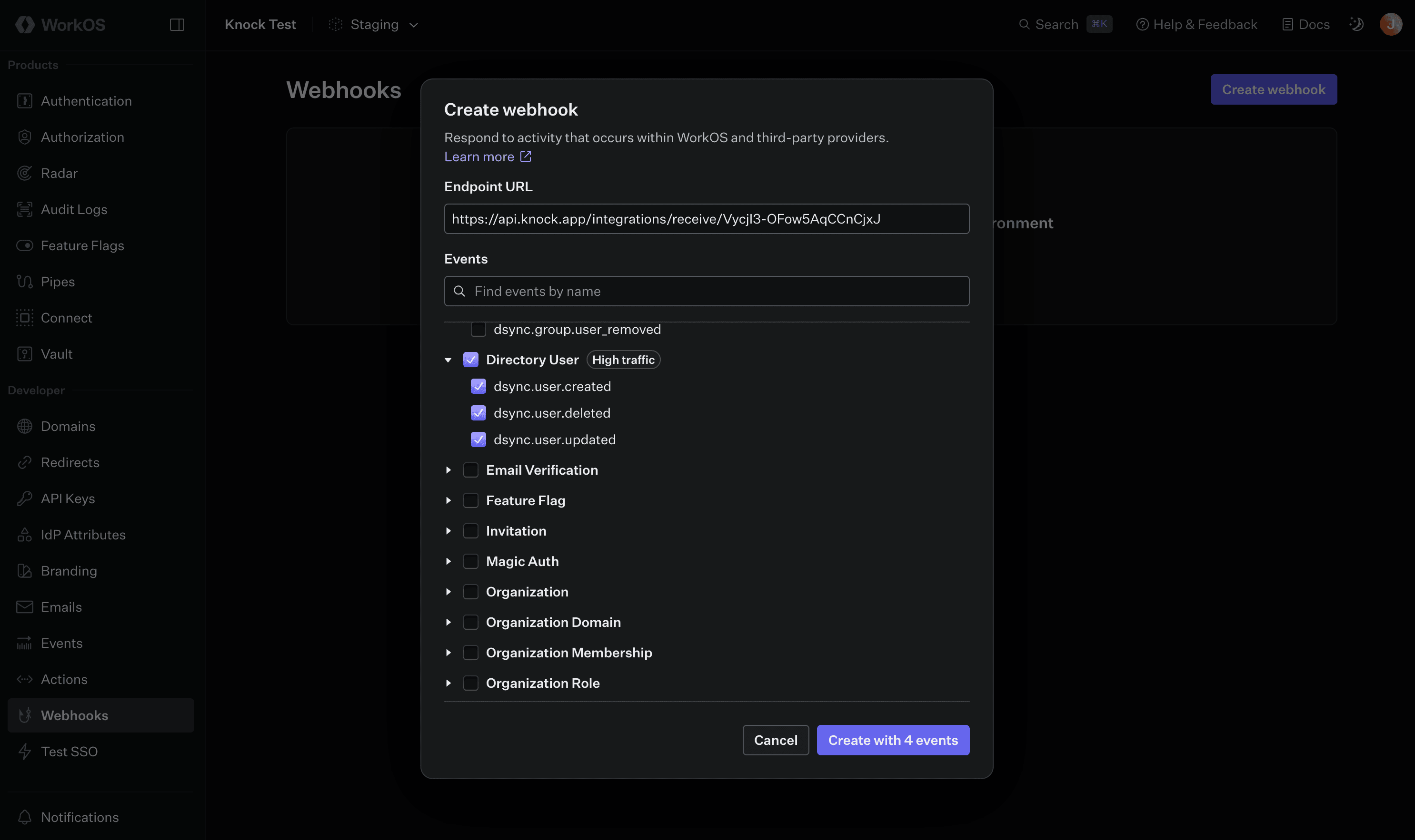 The WorkOS source creation modal showing default action mappings for incoming events